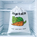 White mesh vegetable storage bag in refrigerator with carrot and lettuce illustration, drawstring closure, labeled 