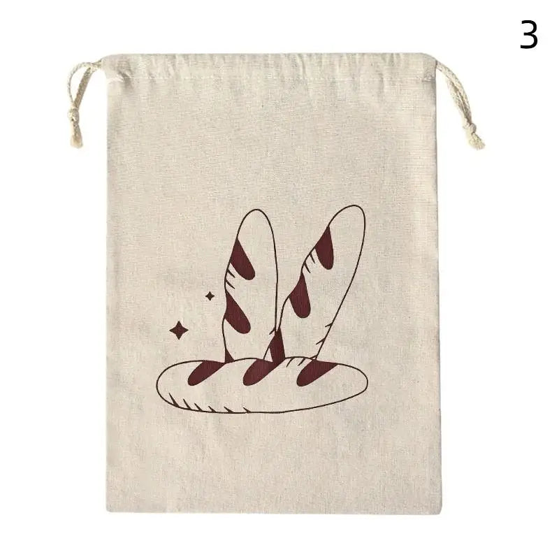 Beige linen bread bag with burgundy illustrated baguettes and decorative stars, drawstring closure for reusable organic loaf 