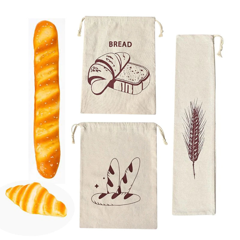 Three cream linen bread bags with brown bread illustrations, displayed with fresh baguette and croissant examples.