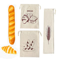 Three cream linen bread bags with brown bread illustrations, displayed with fresh baguette and croissant examples.