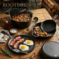 Cast iron cookware set with bacon and eggs cooking in skillet, potatoes in pan, stew in Dutch oven, surrounded by rosemary an