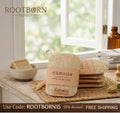 Natural loofah dish scrubbers with kraft paper packaging displayed on wooden surface near window, eco-friendly kitchen cleani
